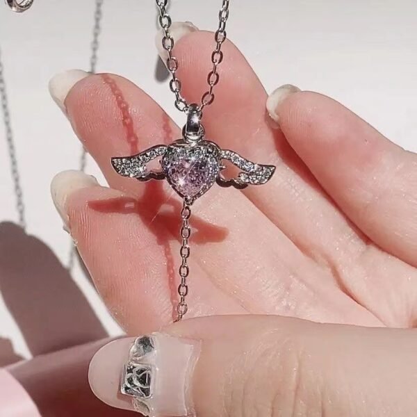 bb5e6408-cb60-47d2-bb25-f4bba6383f2b.jpg Moving Cupid Heart Angel Wings Tassel Necklace With Crystal Clavicle Chain Women Jewelry Gift Valentine's Day